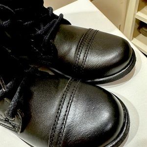 New, tried on, never worn. Black boots. Tie and zip.